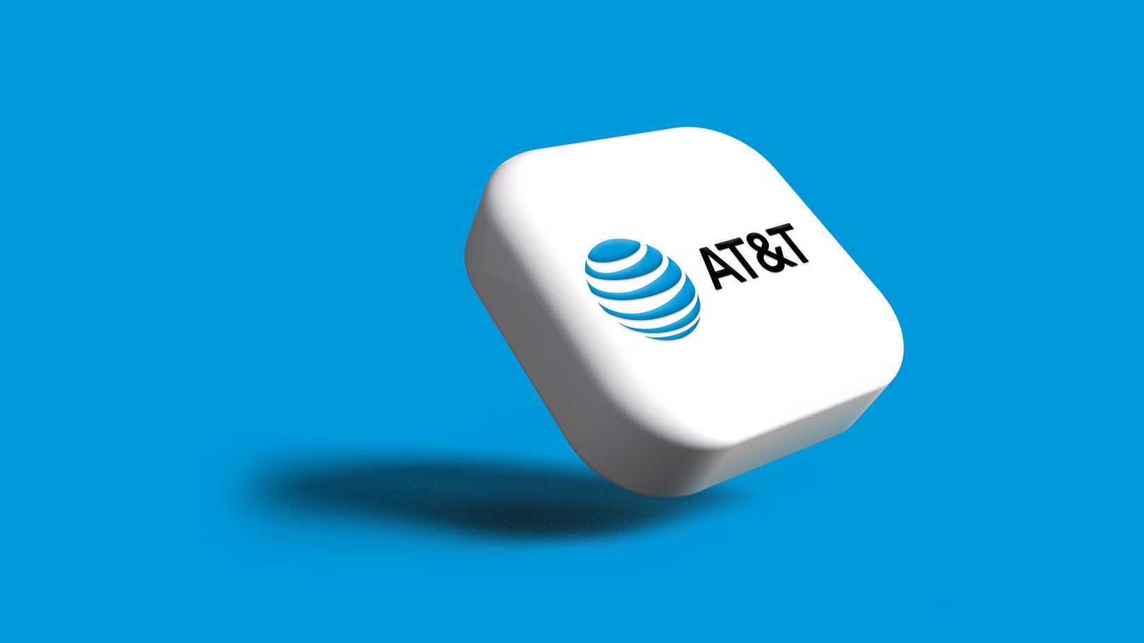 El logotipo de AT&T en un botón blanco sobre fondo azul.