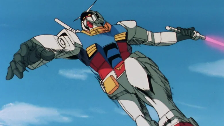 Un Gundam gigante corta con una espada láser en Mobile Suit Gundam